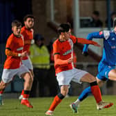 Louis Walsh evades a tackle against Luton. Picture by Simon Gill.