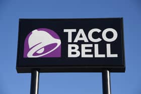 A sign at a Taco Bell restaurant   (Photo by Ethan Miller/Getty Images)