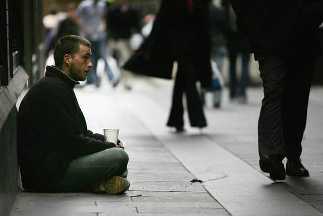 A homeless man begs for small change on the streets (Picture: Christopher Furlong/Getty Images)
