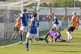 Will Summerfield (second from right) sees his shot find the net at Stratford. Photo: Bedford Town FC.