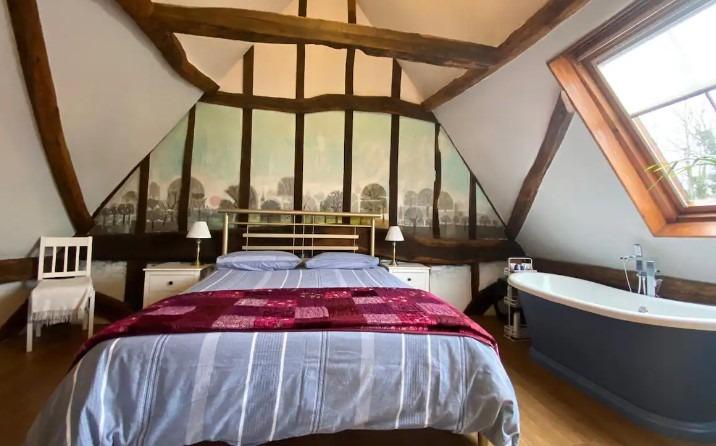 Hosted by Alison, this converted barn is just over the border into Hertfordshire. But get a load of that bedroom, complete with funky bath. There's a kitchen and your own private patio or balcony, depending on what part of the barm you stay in. £97 a night