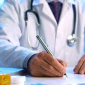 File image of a doctor sitting at a desk