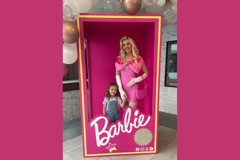 This little girl was over the moon after being pictured holding Barbie's hand in the Barbie box at Bedford's Harpur Centre.