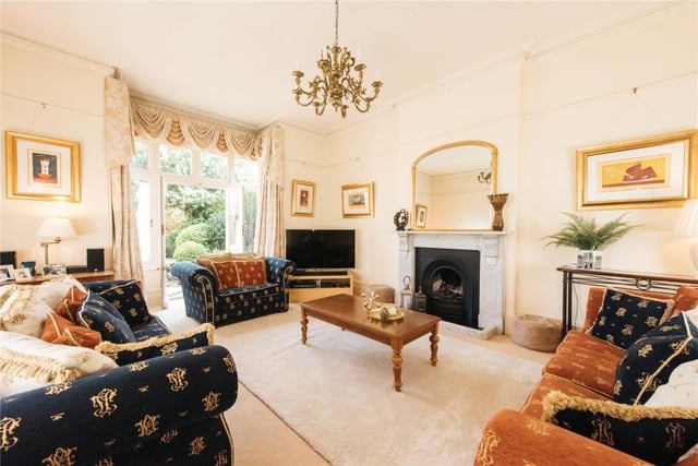 This room is at the rear with part glazed doors giving views of and access to the rear garden. A traditional marble fireplace with a real flame gas fire provides a focal point