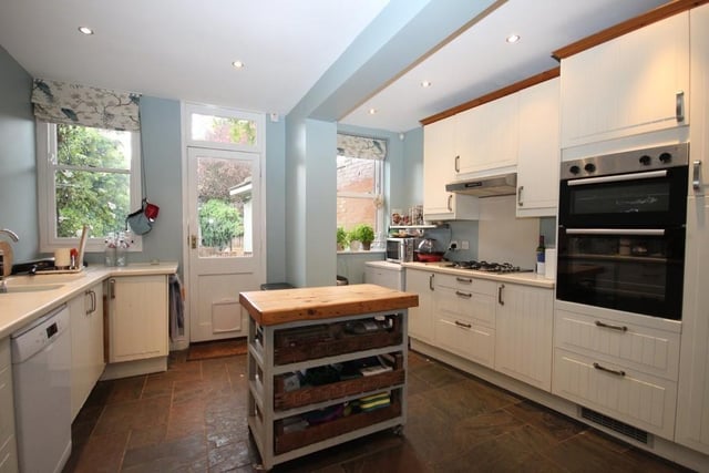 Measuring 30ft, the kitchen features a built-in four ring gas hob with extractor over, cupboards and drawers under, a double built-in oven and plumbing for dishwasher