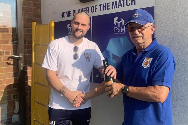Man of the match and goalscorer Danny Watson has his award presented to him by Colin Marlow. Photo: Ampthill Town FC.