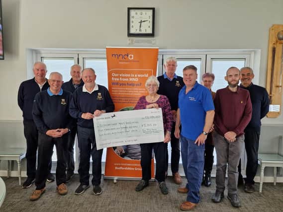 Pictured are the past senior captain at Bedfordshire GC along with the current senior captain Trevor Pasquire, committee and MND representatives.