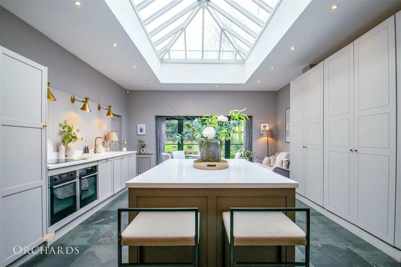 The large kitchen/breakfast room boasts a huge skylight and double doors opening on to the garden