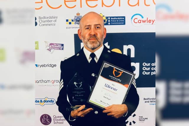 Sergeant Phil Boyd with the Community Champion award (Picture: Bedford Community Policing Team)