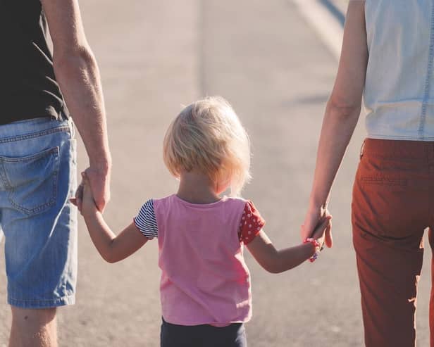 Famlily holding hands. Image by Pexels from Pixabay