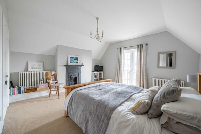 The large main bedroom suite includes a luxury four piece en suite, fitted wardrobes and a Juliet balcony