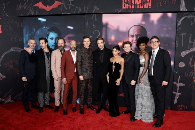 John Turturro, Colin Farrell, Peter Sarsgaard, Jeffrey Wright, Paul Dano, Robert Pattinson, Zoe Kravitz, Andy Serkis, Jayme Lawson, and Dylan Clark pose for a group photo at the premiere. (Photo by Dimitrios Kambouris/Getty Images)