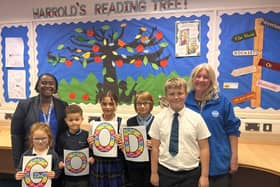 Staff and pupils from Harrold Primary Academy celebrate their new Ofsted rating