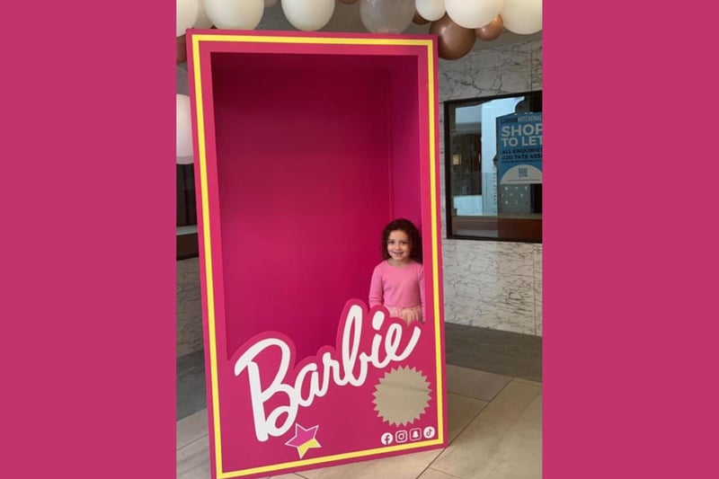 This little Barbie fan was all smiles and definitely dressed to match Barbie when she joined fans to pose in the Barbie box.