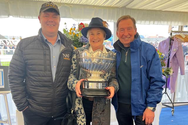 Diana Noel celebrates with the winning trophy