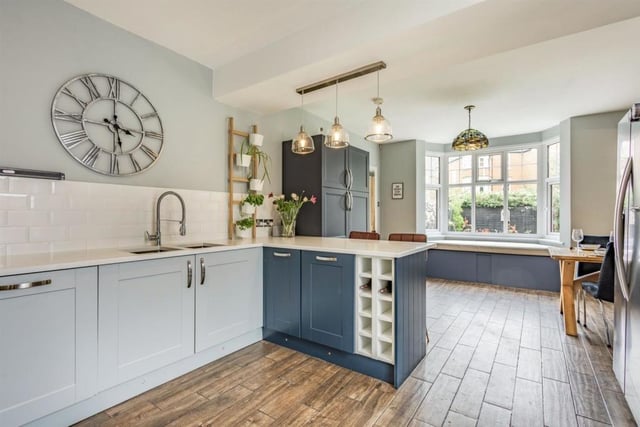 The contemporary fitted kitchen area is well-appointed, featuring a dual control aga, ample storage and a breakfast bar