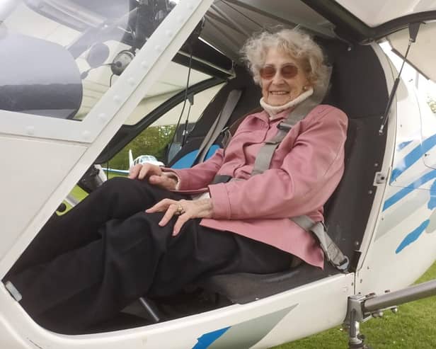 Muriel enjoys a flight for her 90th birthday across Cambridge