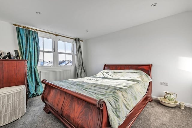The accommodation extends over three floors - and this bedroom is on the top floor