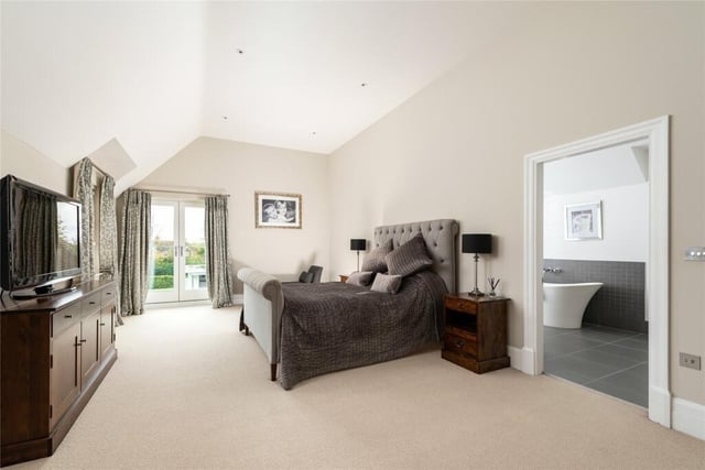 This bedroom suite has underfloor heating throughout and is accessed via steps down from the landing. It features a Juliet balcony with views over the garden. The en suite bathroom has a walk-in shower area, a double ended contemporary bath. And if that wasn't enough, there is also a dressing room