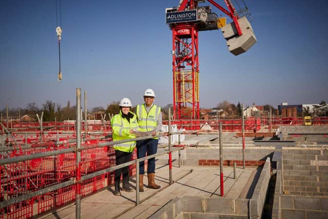 Alexandra Johnson, Sales and Marketing Director for Adlington Retirement Living, and Mohammad Yasin MP at the construction site for The Newells in Kempston