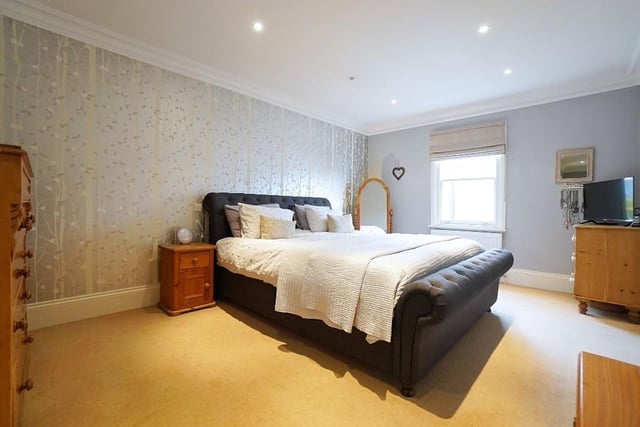 This bedroom - which measures 32ft by 11ft 10in - includes an en suite bathroom and a dressing room