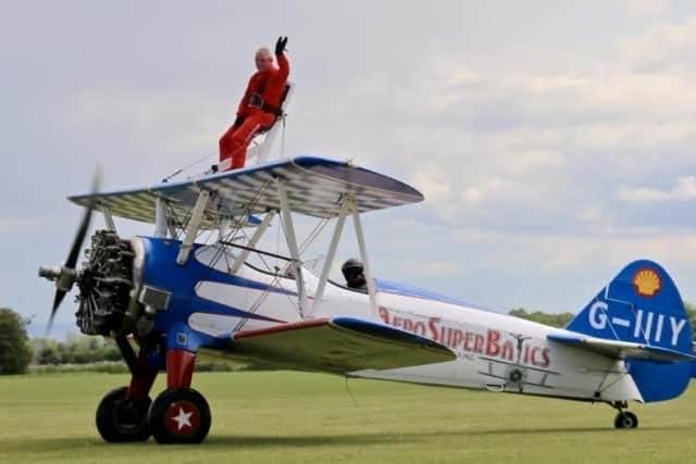 Bedfordshire Mason Terry Thurley about to take off on his daring wing-walking trip