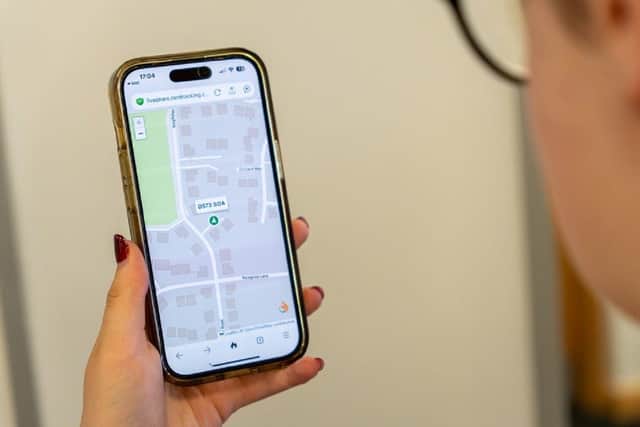 A customer checks Burton Smith’s live tracker