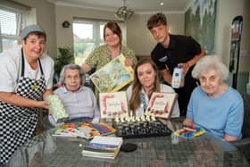 Staff and residents at Blakelands Lodge Care Home with Hannah from David Wilson Homes