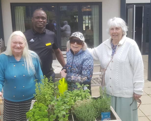 Elstow Homemaker Chinedu Egbochuku with residents Joy Stallwood, Anne Poole and Joan Stickland
