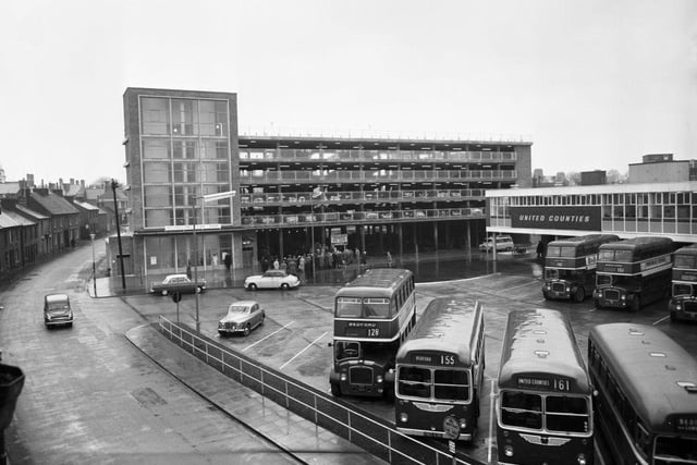 Buses parked at Allhallows Bedford bus station next to the new multi-storey car park on 27th January 1961 in Bedford.