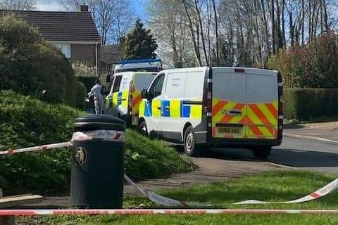 Police vans in Sharnbrook