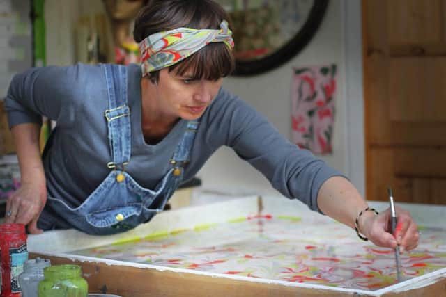 Milton Keynes textile artist Janey Whitehorn- hand dyes silks at her kitchen table to make her products