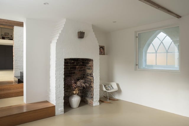 A fireplace, perfect for a woodburner, remains in the snug where once a copper stood in what was then the washroom