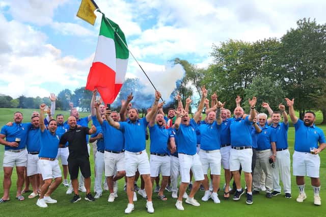 The Italians celebrate their win.