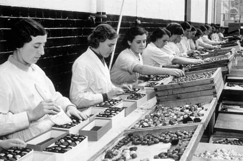 Workers packing Christmas chocolates at the Meltis sweet factory in Bedford on 24th November 1936.