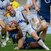 Matt Worley of Bedford Blues is tackled during the game with Sale Sharks. (Photo by Ben Roberts Photo/Getty Images)