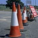 Traffic cones separating construction site and works access from public highway. Photo by Liz Artindale/Construction Photography/Avalon/Getty Images