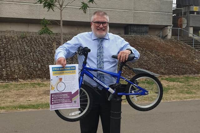 Mayor Dave Hodgson with a donated bike