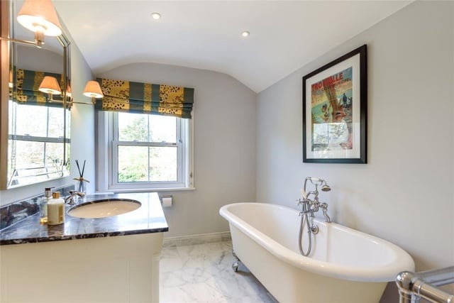 This room includes a roll-top bath and a Villeroy & Boch sink unit