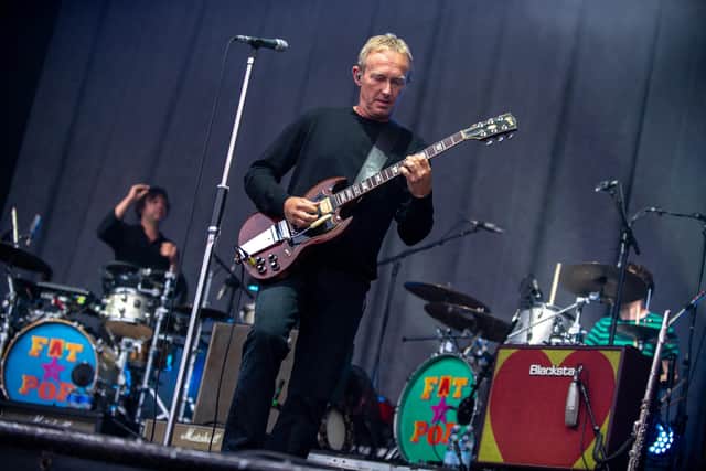 Steve Cradock performing with Paul Weller at Bedford Park on Saturday (Photo by David Jackson)