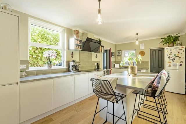 This room provides a sociable space and has a good range of modern units, work surfaces and some built-in appliances as well as a central island incorporating a breakfast bar