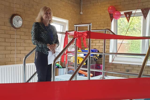 Red ribbon abounds as Bedford MS Therapy Centre manager Tracy Mckenzie prepares for the opening of the new hydrotherapy pool
