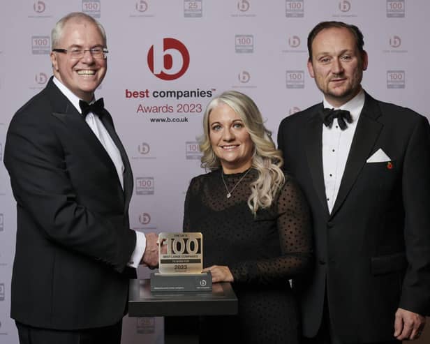 Katherine White and Steve Jones ( right) receive their Best Companies to Work for Award