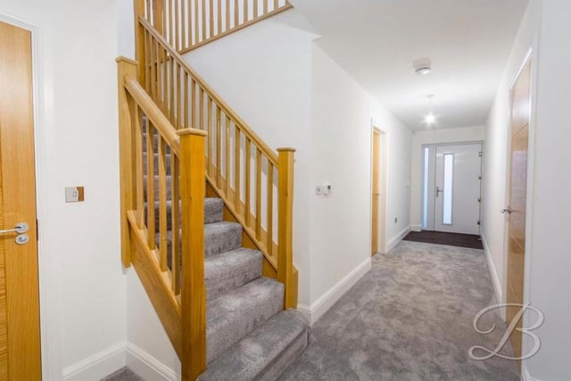 The entrance hallway leads to a downstairs toilet with wash hand basin, and also guides us to the oak staircase, taking us to the first floor of the Ravenshead property.