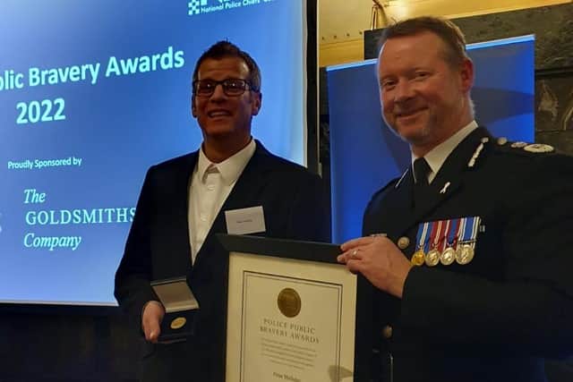 Heroic Peter Holliday receives his award