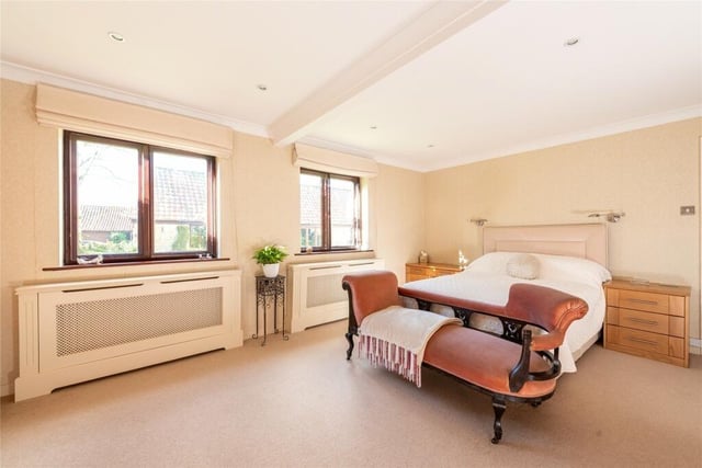 The suite is accessed via a dressing room which is currently being used as an office. It has a window overlooking the front garden and a door to the bedroom which also overlooks the front garden and has a custom built range of oak furniture