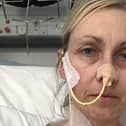 Louise McCool in hospital attached to a feeding tube after one of her surgeries