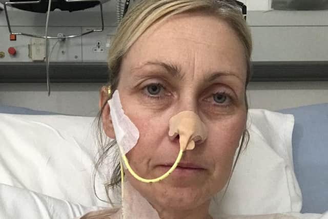 Louise McCool in hospital attached to a feeding tube after one of her surgeries