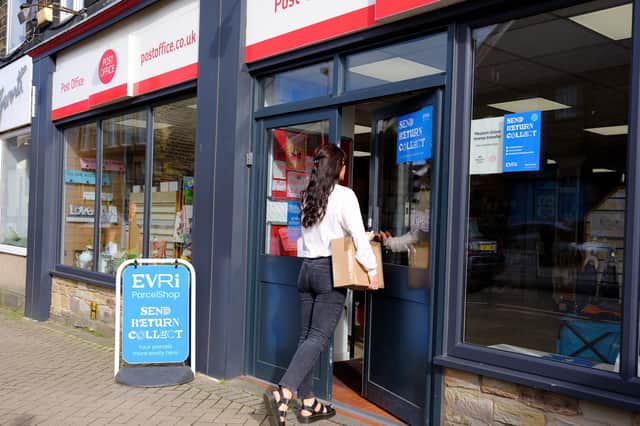 Evri signs in the window of a Post Office branch. Picture: Mark Dolby