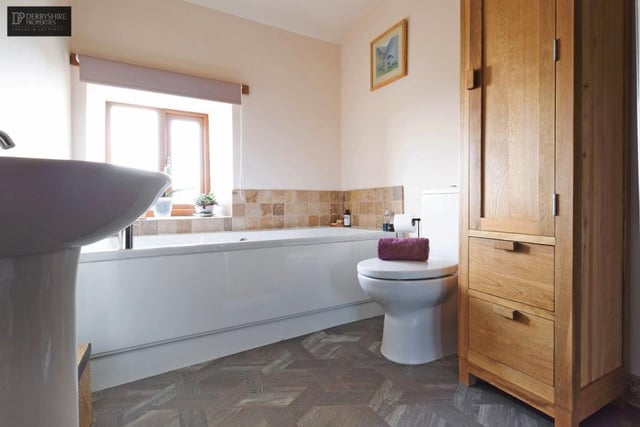 The bathroom has a modern four-piece suite comprising bath, corner shower cubicle with gravity fed shower, hand basin and wc.